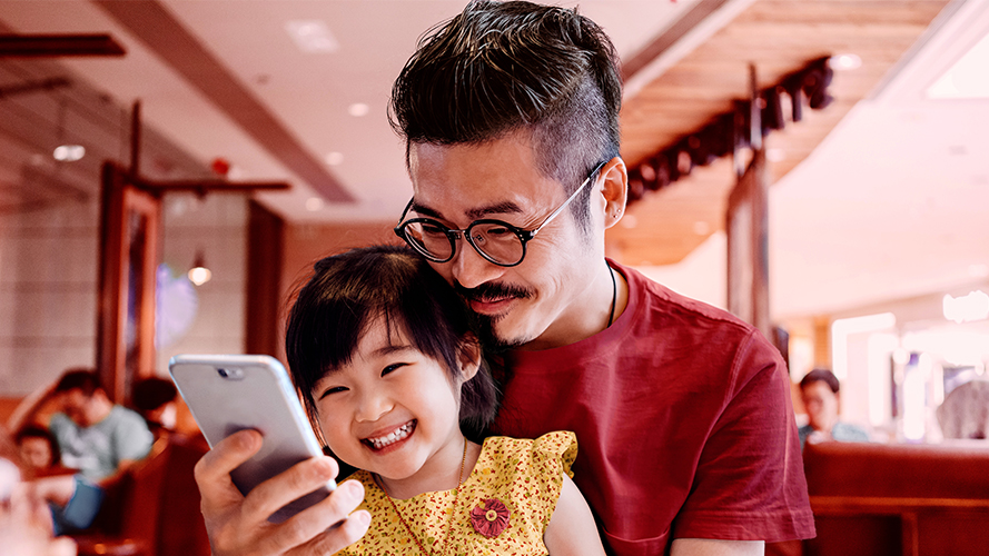 HSBC Premier - Dad and child dining; image used for HSBC Malaysia Wealth Solutions page.