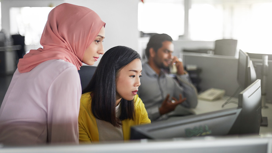 A man and woman are are laughing together while building furniture; image used on HSBC Malaysia Online and on your side page.